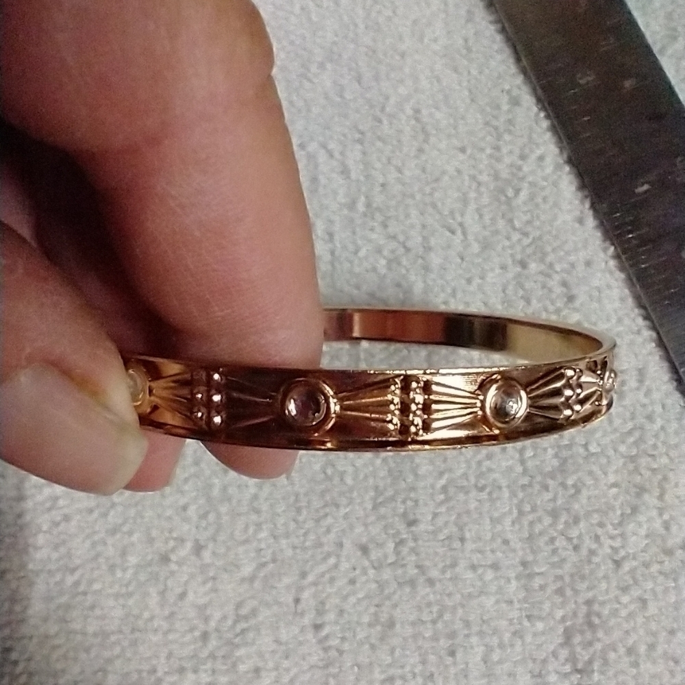Goldtone bangle bracelet approx. 2.5 wide